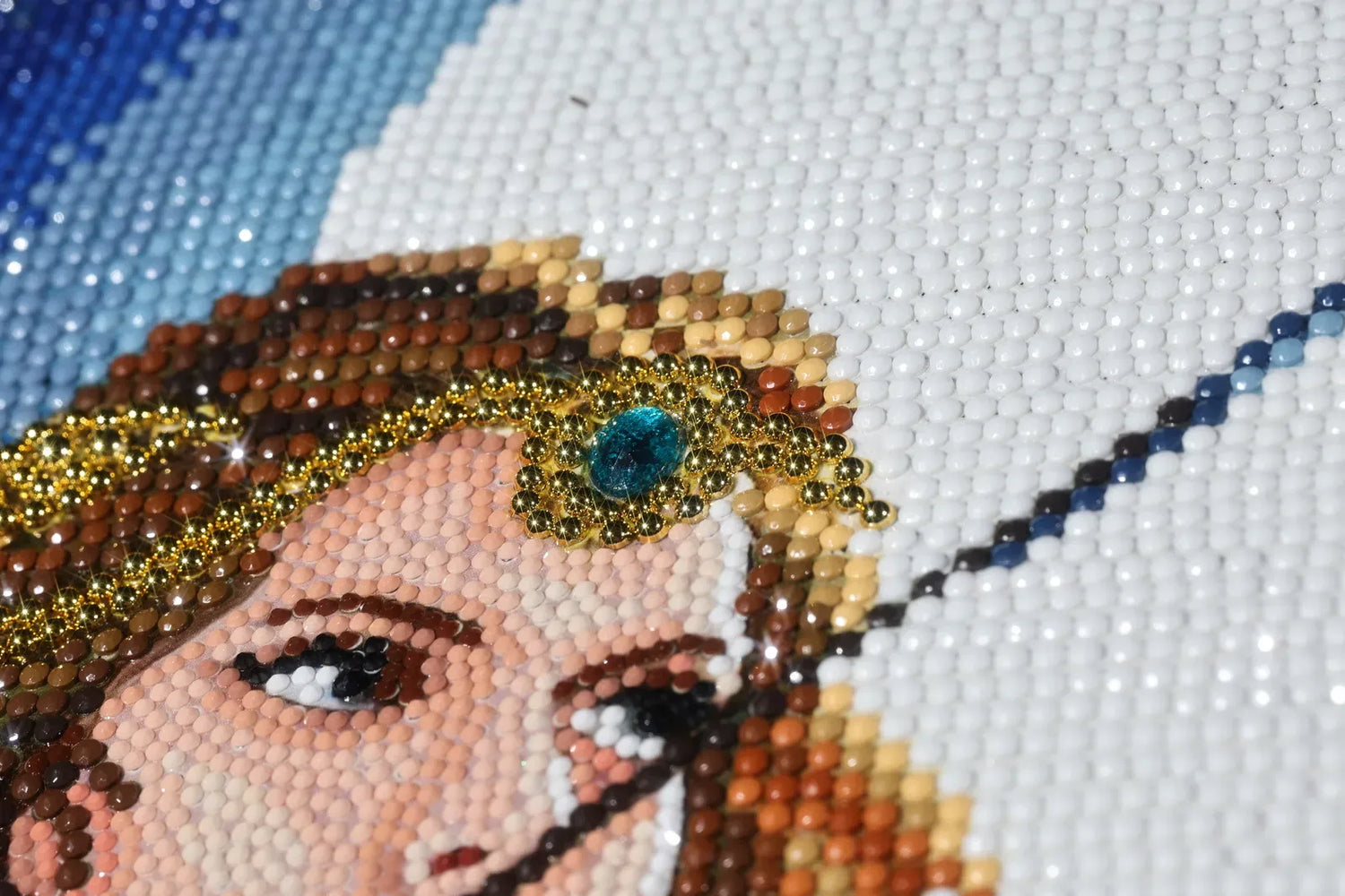 A finished Artemis diamond art canvas featuring a brilliant blue gemstone on her forehead, sparkling drills, and mystical moonlit details - FEELOOK Art