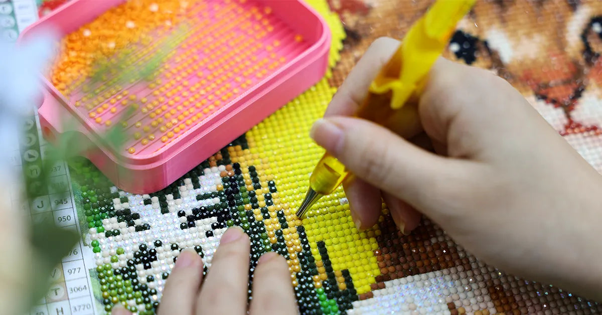 Hands crafting with a drill pen and bead tray, showcasing DIY process - FEELOOK Art