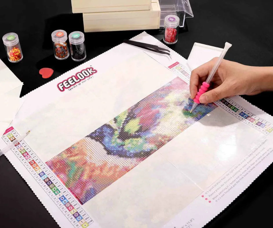 FEELOOK Art diamond painting release paper with partially completed colorful diamond art, color chart, crafting tools, and drill containers - FEELOOK Art