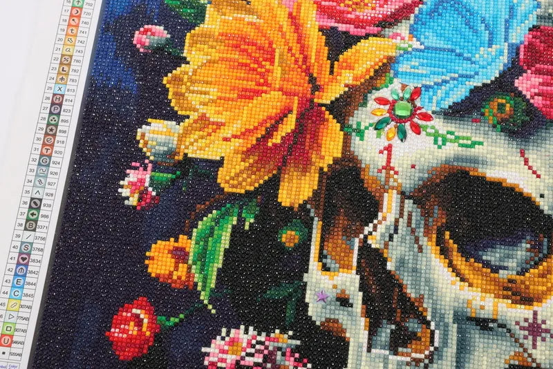 Flower Skull Momento Mori 5D diamond painting close-up with special shaped drills adding gemstone sparkle to floral skull details - FEELOOK Art