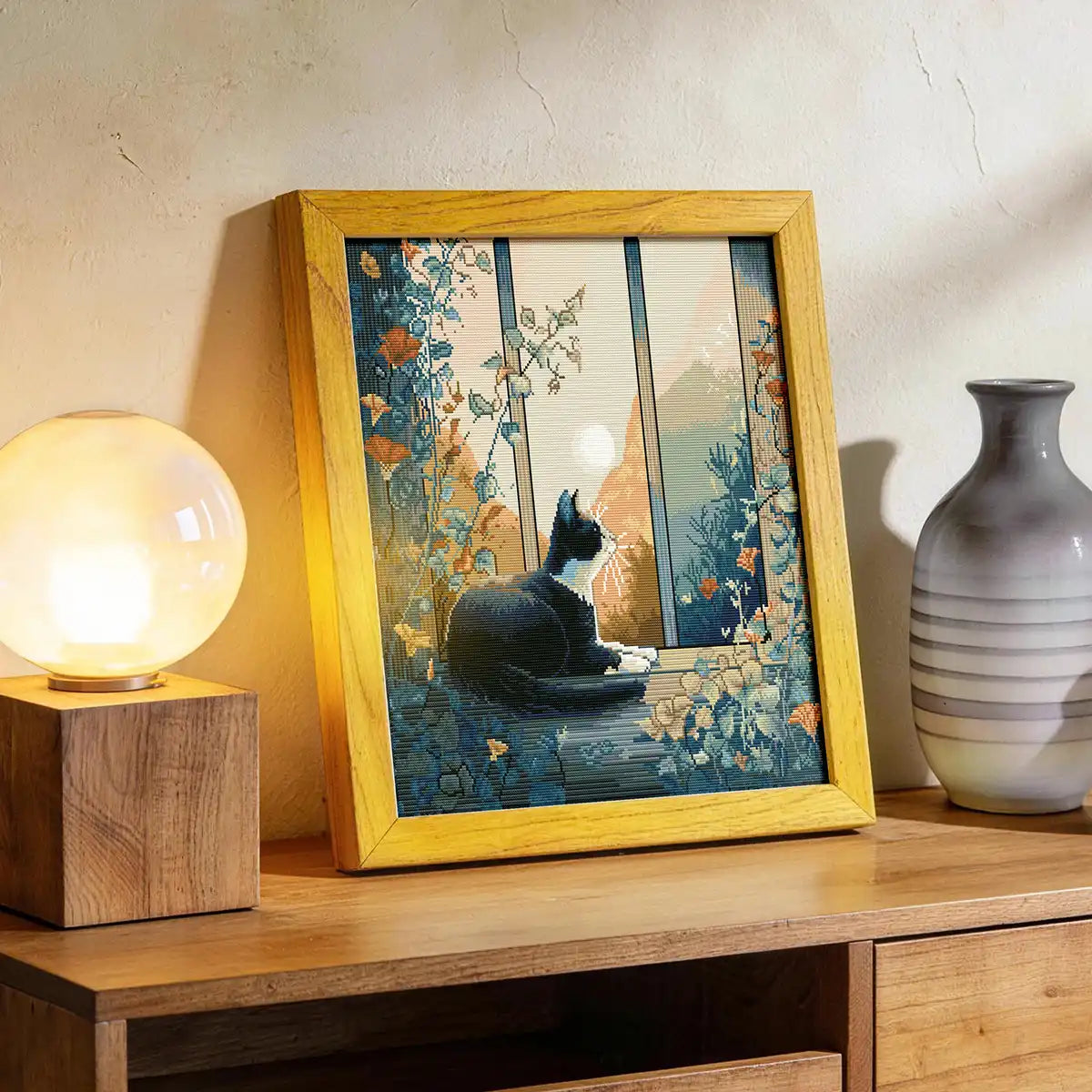 At Sunset diamond painting displayed on a wooden cabinet with a lamp and vase - FEELOOK Art