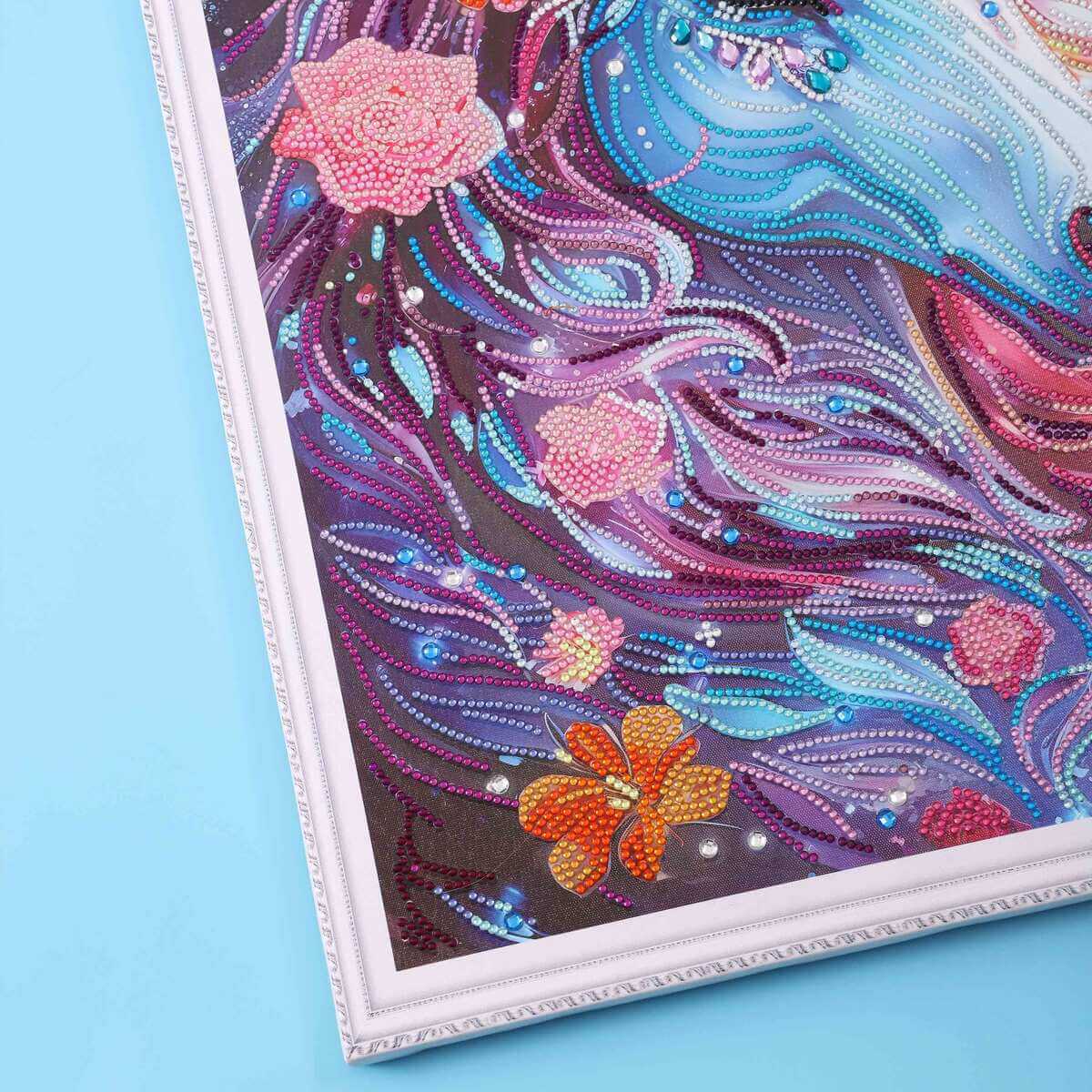 Detail view of Blooming Unicorn's mane and flowers with shimmering diamonds.