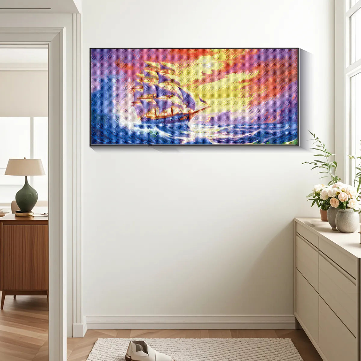 Sailing ship diamond art framed on a rustic coastal home wall.