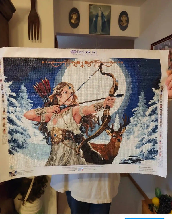 Customer showing a completed winter archer diamond painting - FEELOOK Art