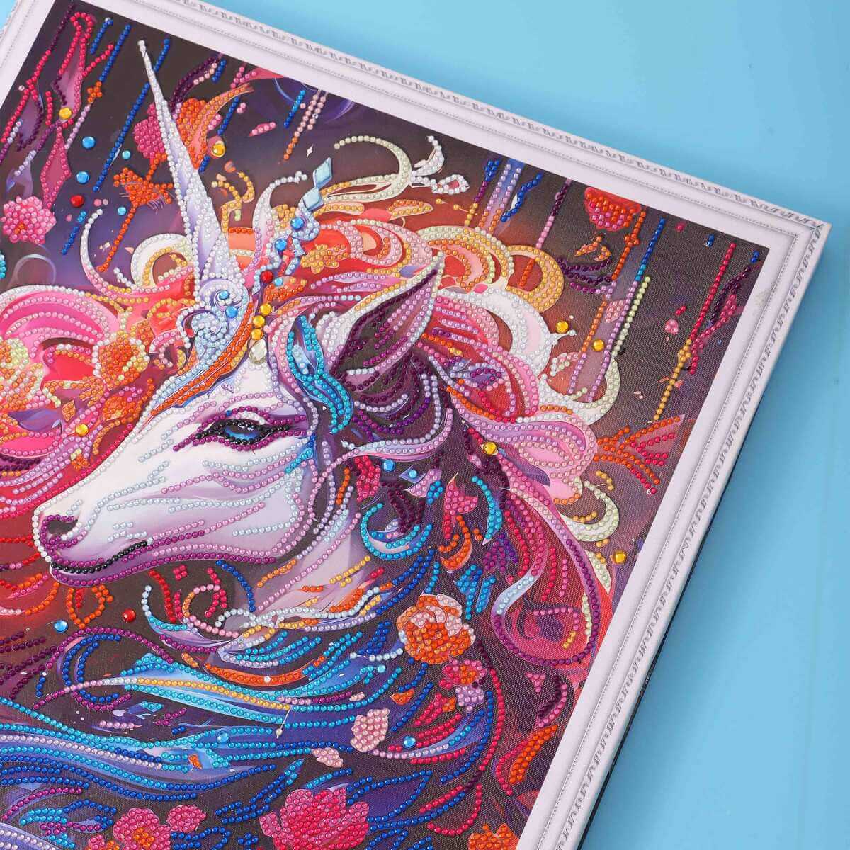 Close-up of the unicorn’s shimmering mane and magical details in the diamond painting.