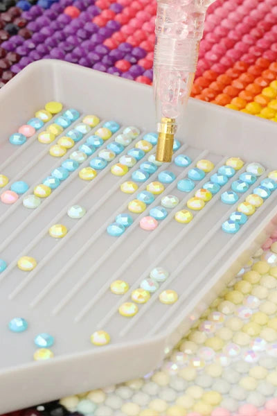 Sparkling acrylic diamonds in tray, showcasing the vibrant shine and quality of FEELOOK Art diamond painting kits