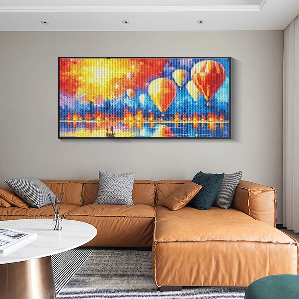Colorful hot air balloon diamond painting framed in boho living room, highlighting meditative benefits of diamond painting.