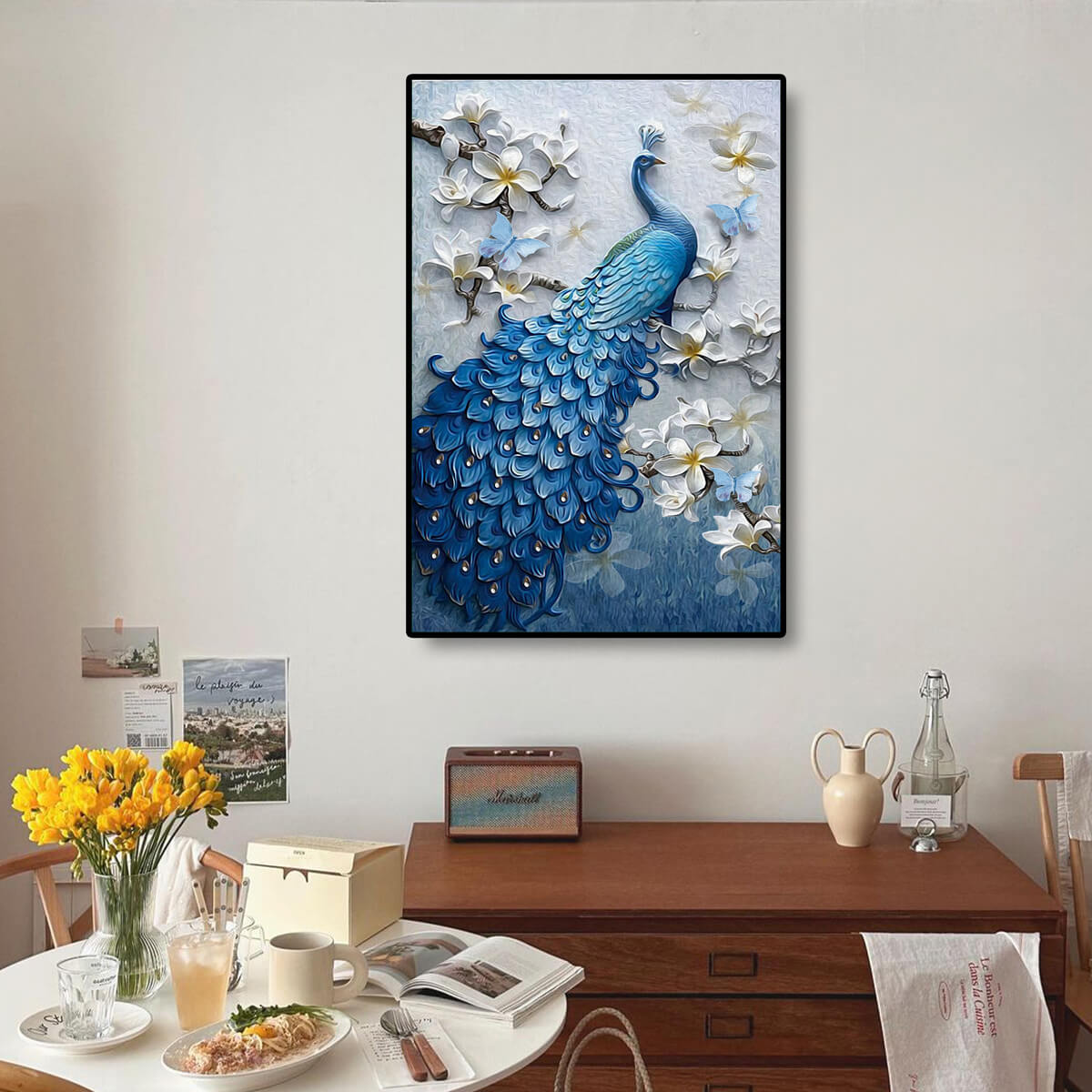 Peacock diamond painting kit displayed as wall art, bringing an exquisite touch of elegance and color to any room with diamond painting gems.