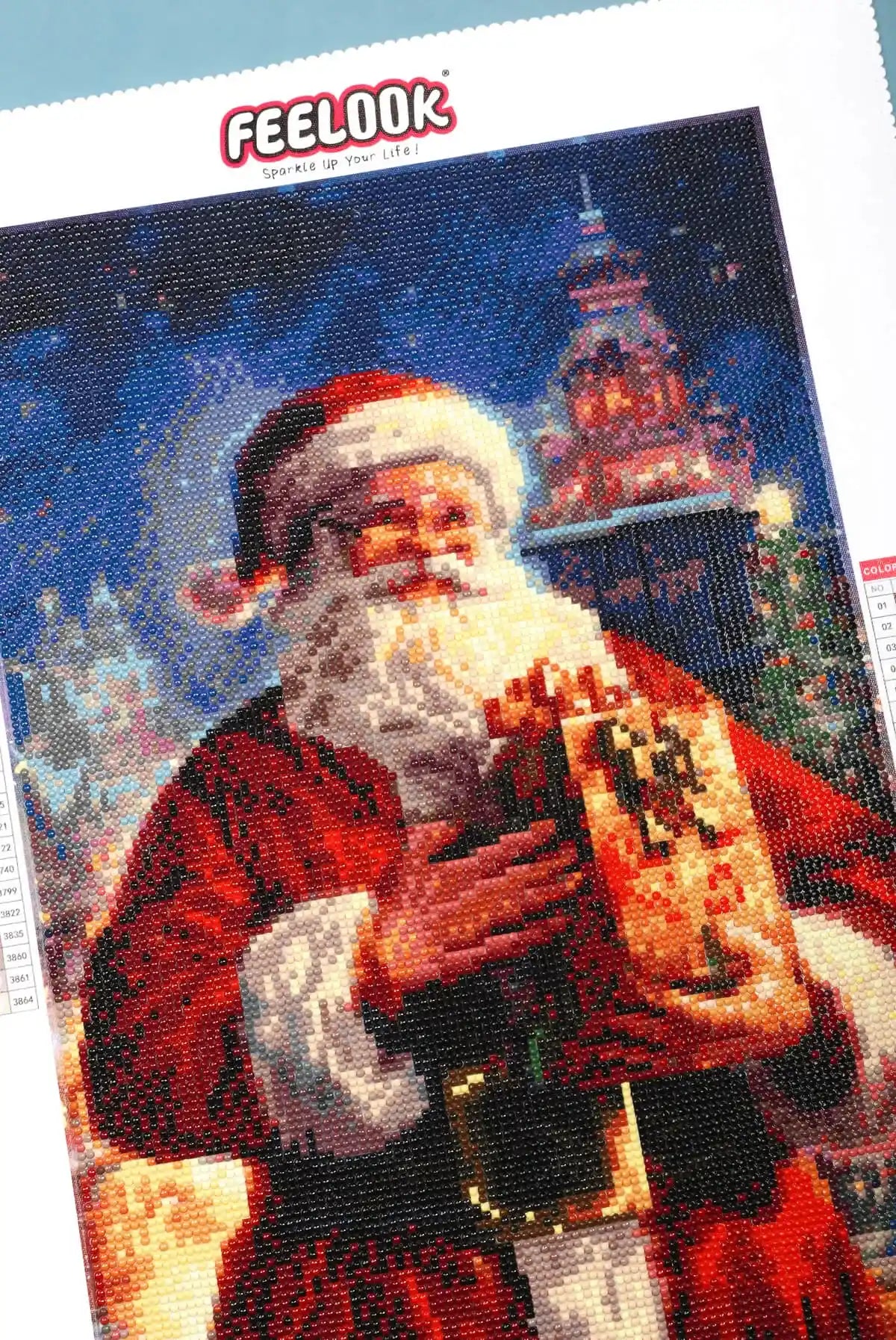 Close-up of Santa's face and beard in diamond painting.
