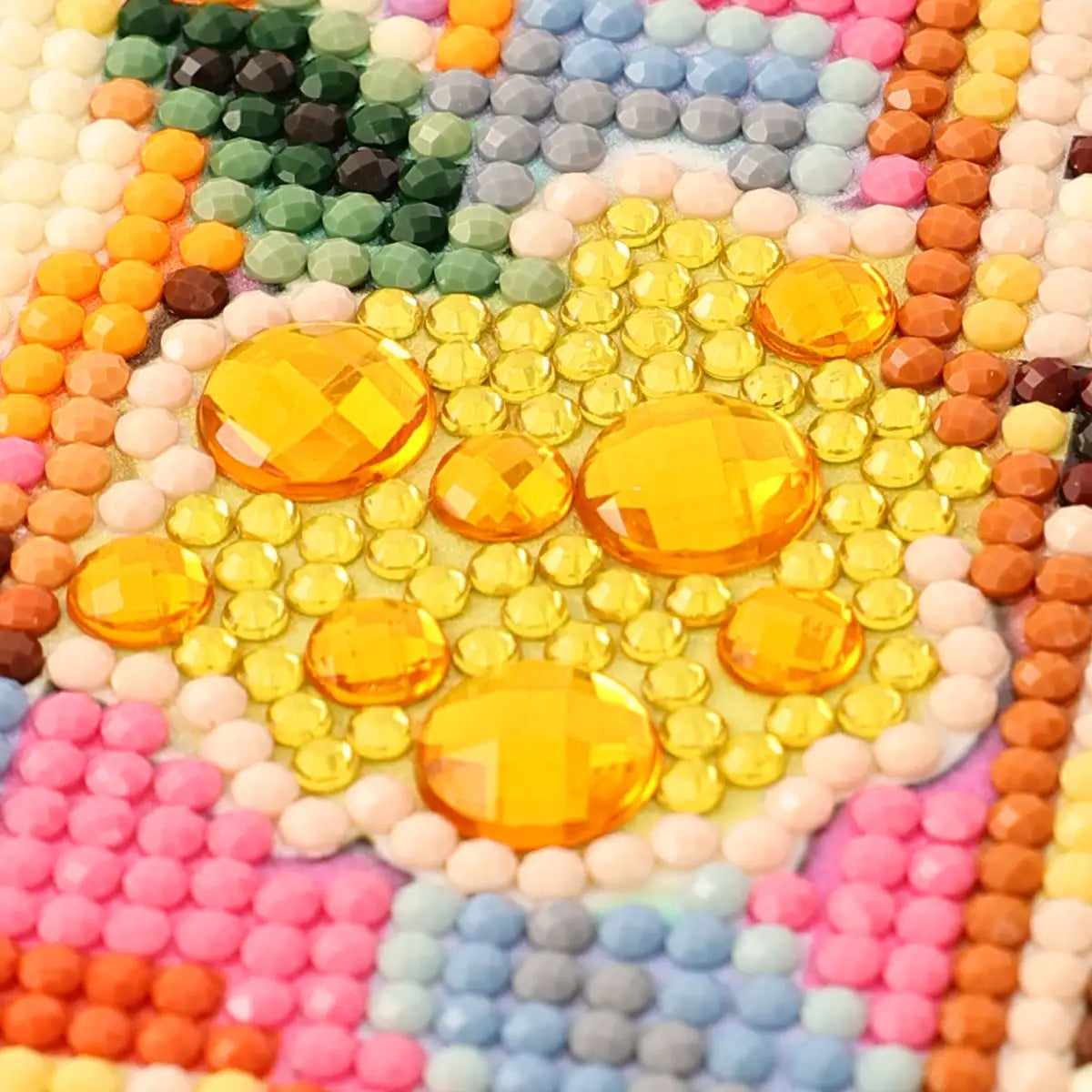Close-up of Spots diamond painting special drills with faceted yellow gems and colorful resin drills - FEELOOK Art
