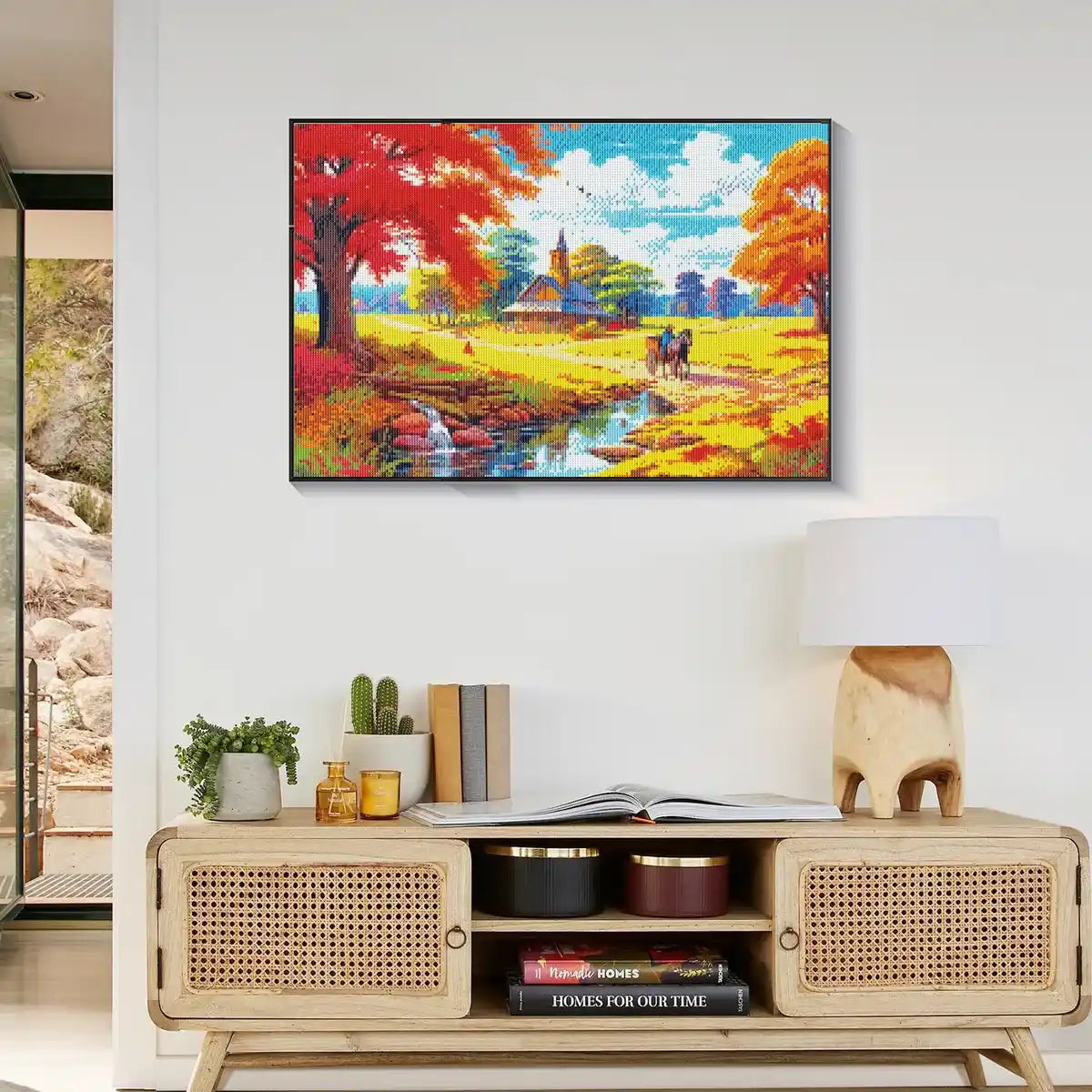 Colorful fall scenery in diamond painting displayed in modern decor room.