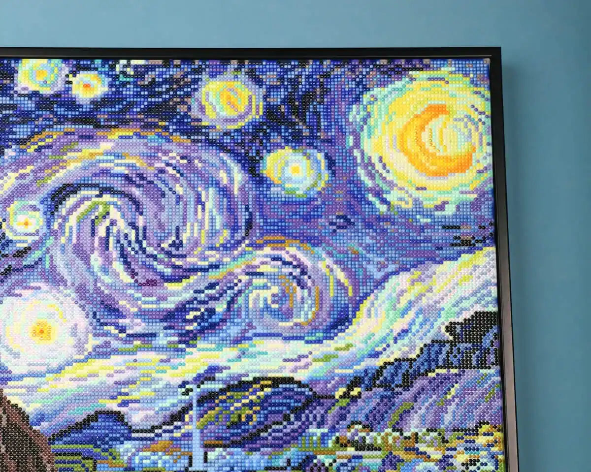 Close-up of the swirling night sky and stars in The Starry Night diamond painting.
